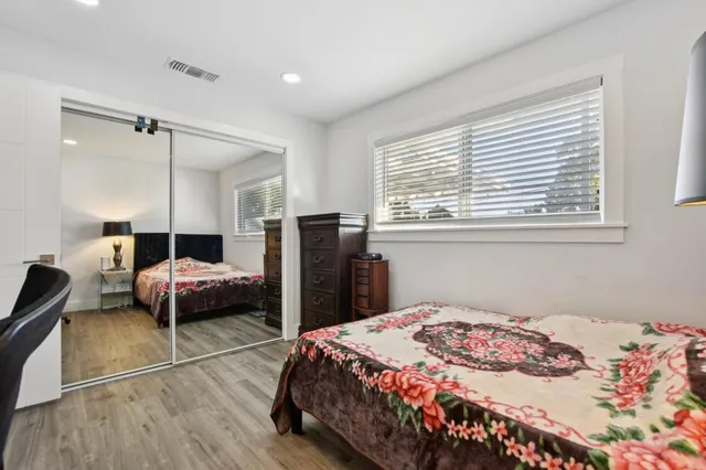 a bedroom with a bed and a closet