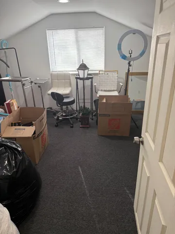 a bedroom with furniture and a window