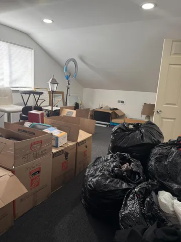 a kitchen with stove a sink and a window