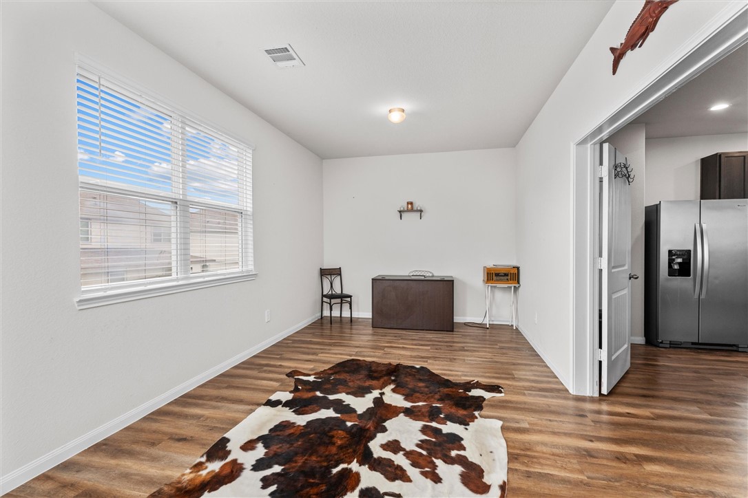 980 Rice Drive Bryan, TX 77803 - Photo 13 of 31 a view of a bedroom with wooden floor windows and cabinet