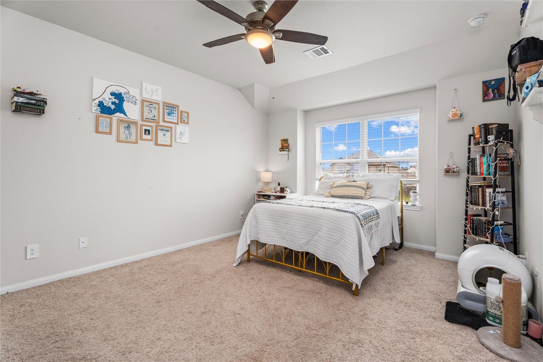 980 Rice Drive Bryan, TX 77803 - Photo 17 of 31 a bedroom with a bed and cabinets