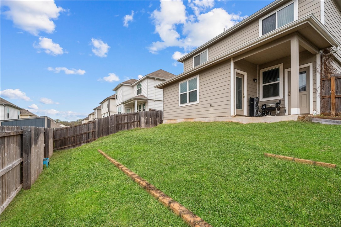 980 Rice Drive Bryan, TX 77803 - Photo 26 of 31 a view of a house with a yard and porch