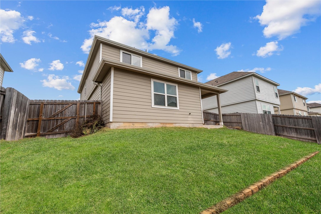 980 Rice Drive Bryan, TX 77803 - Photo 27 of 31 a view of a house with a yard