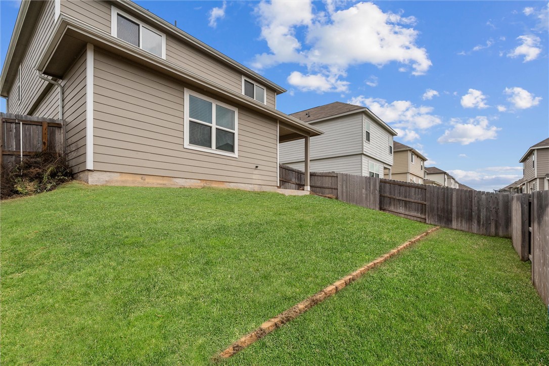 980 Rice Drive Bryan, TX 77803 - Photo 28 of 31 a backyard of a house with lots of green space