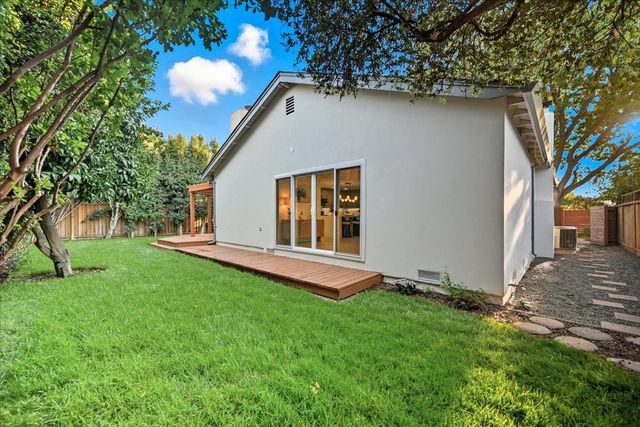 a bedroom with a large bed and a large window