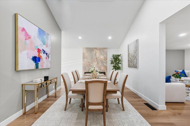 an aerial view of a house with a yard and garden