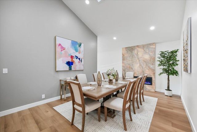 an aerial view of a house with a garden and yard