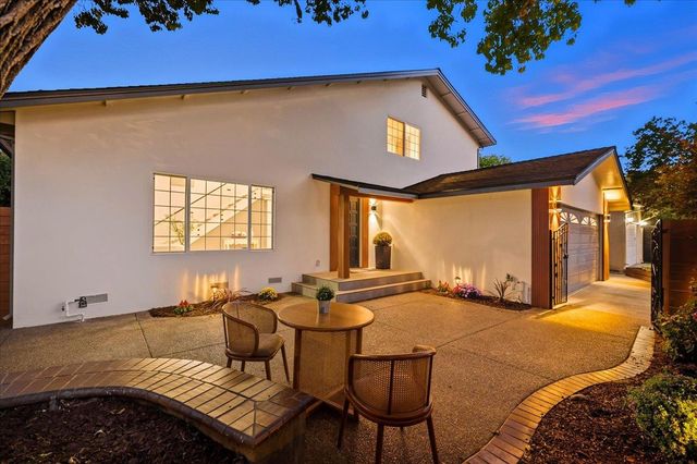 a outdoor living space with furniture and garden view
