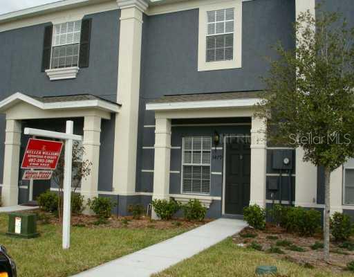 3479 Wilshire Way Road Orlando, FL 32829 - Photo 1 of 1 a front view of a house with garden