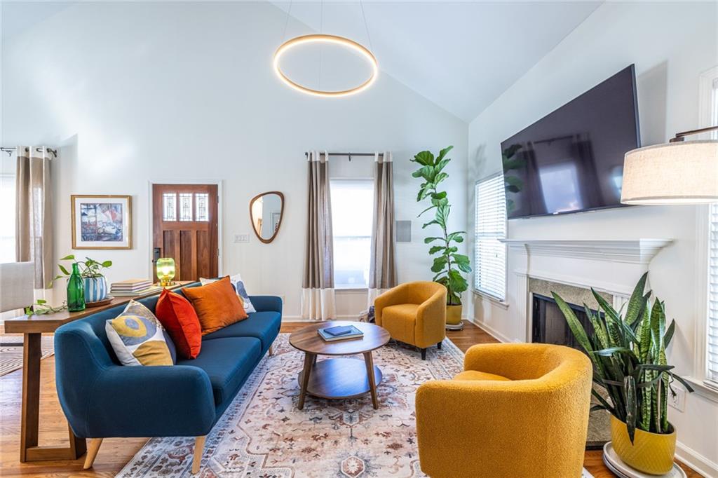 69 Randolph Street Northeast, Unit A Atlanta, GA 30312 - Photo 11 of 50 a living room with furniture potted plant and a fireplace