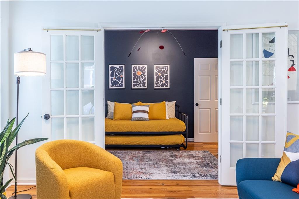 69 Randolph Street Northeast, Unit A Atlanta, GA 30312 - Photo 13 of 50 a bedroom with furniture and a rug