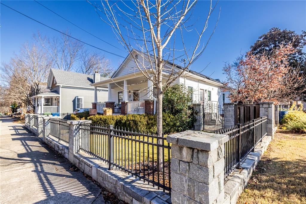 69 Randolph Street Northeast, Unit A Atlanta, GA 30312 - Photo 2 of 50 a view of a house with wooden fence