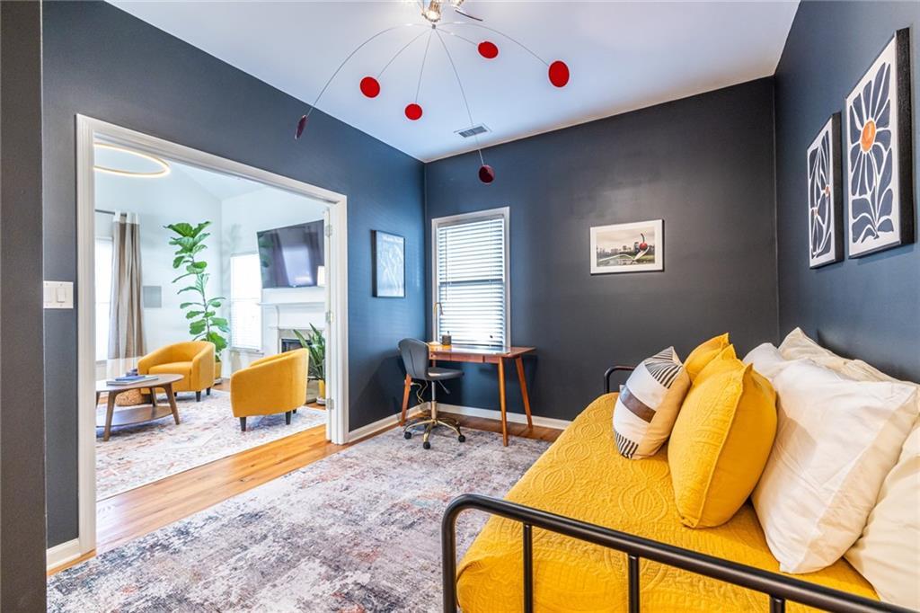 69 Randolph Street Northeast, Unit A Atlanta, GA 30312 - Photo 27 of 50 a bedroom with a bed and wooden floor