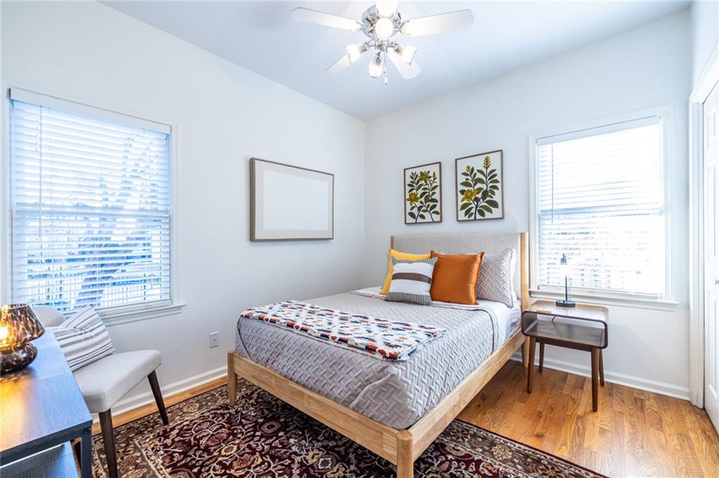 69 Randolph Street Northeast, Unit A Atlanta, GA 30312 - Photo 34 of 50 a bedroom with a bed and a table in it with window