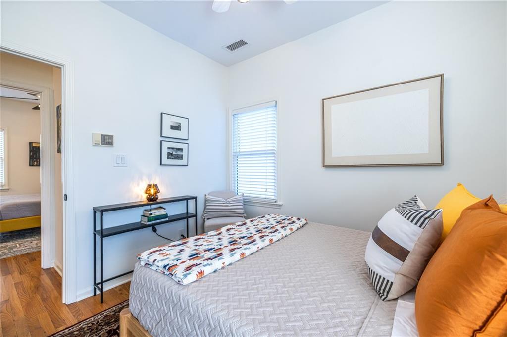 69 Randolph Street Northeast, Unit A Atlanta, GA 30312 - Photo 36 of 50 a bedroom with a bed and a workspace