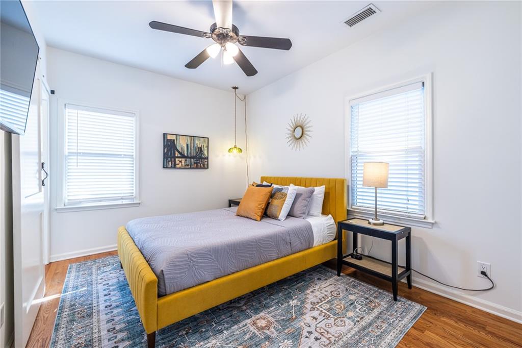 69 Randolph Street Northeast, Unit A Atlanta, GA 30312 - Photo 37 of 50 a bedroom with a bed and a table