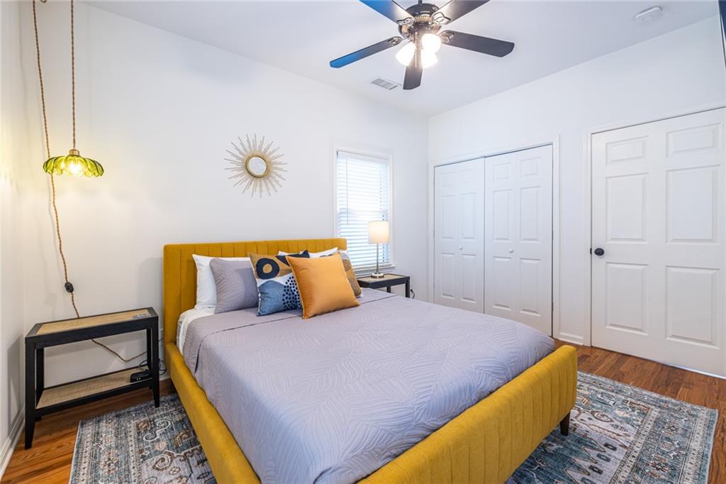 69 Randolph Street Northeast, Unit A Atlanta, GA 30312 - Photo 39 of 50 a bedroom with a bed and a chandelier