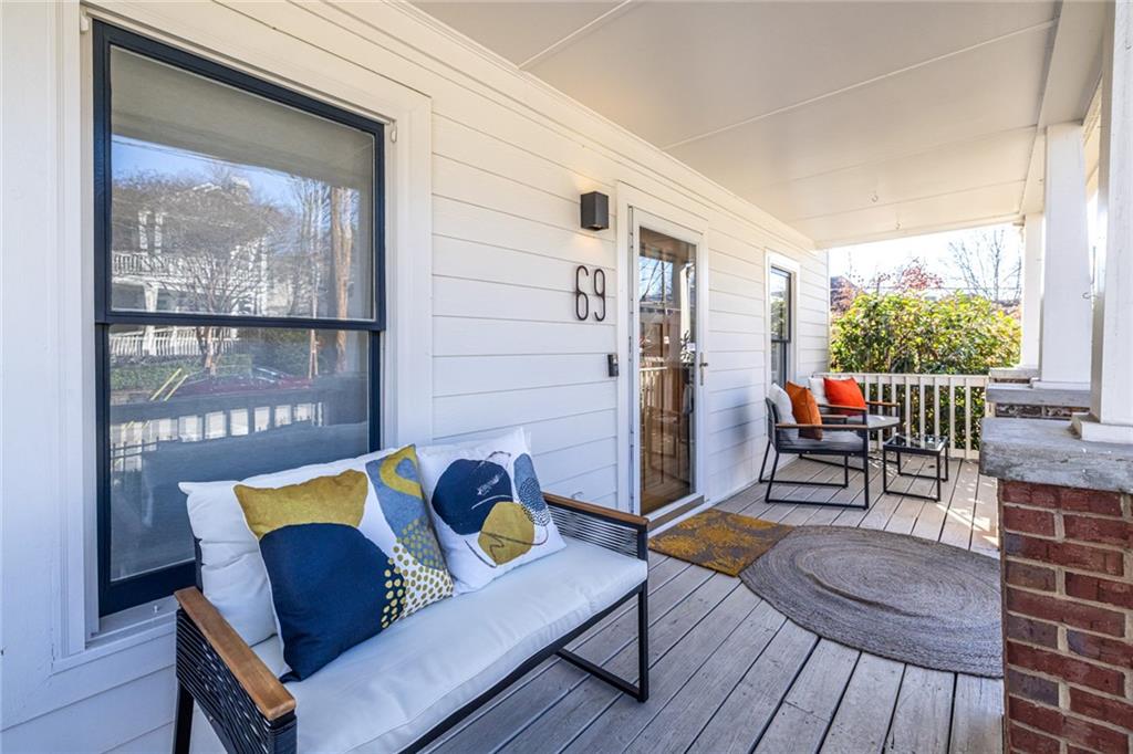 69 Randolph Street Northeast, Unit A Atlanta, GA 30312 - Photo 4 of 50 a living room with furniture and a floor to ceiling window