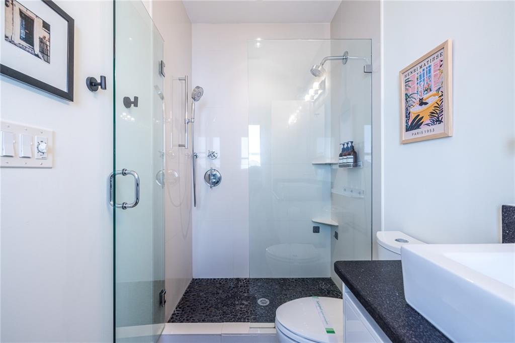 69 Randolph Street Northeast, Unit A Atlanta, GA 30312 - Photo 43 of 50 a bathroom with a toilet a sink and shower