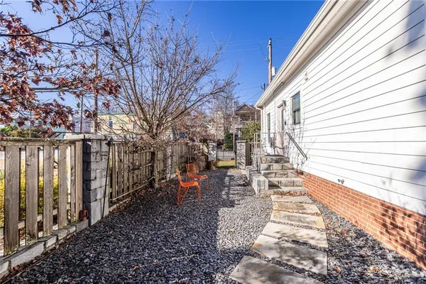 a view of a backyard with sitting area