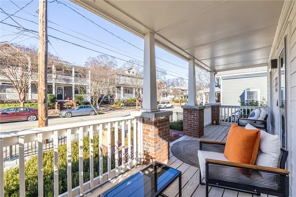 a view of a living room and balcony