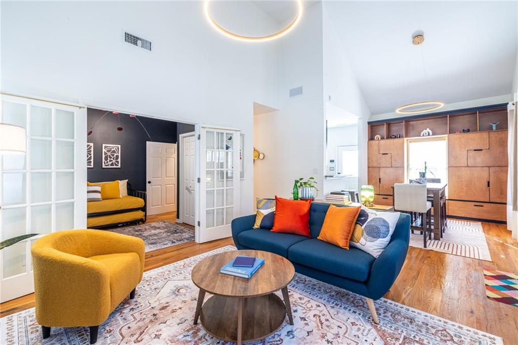 69 Randolph Street Northeast, Unit A Atlanta, GA 30312 - Photo 10 of 50 a living room with furniture and a rug