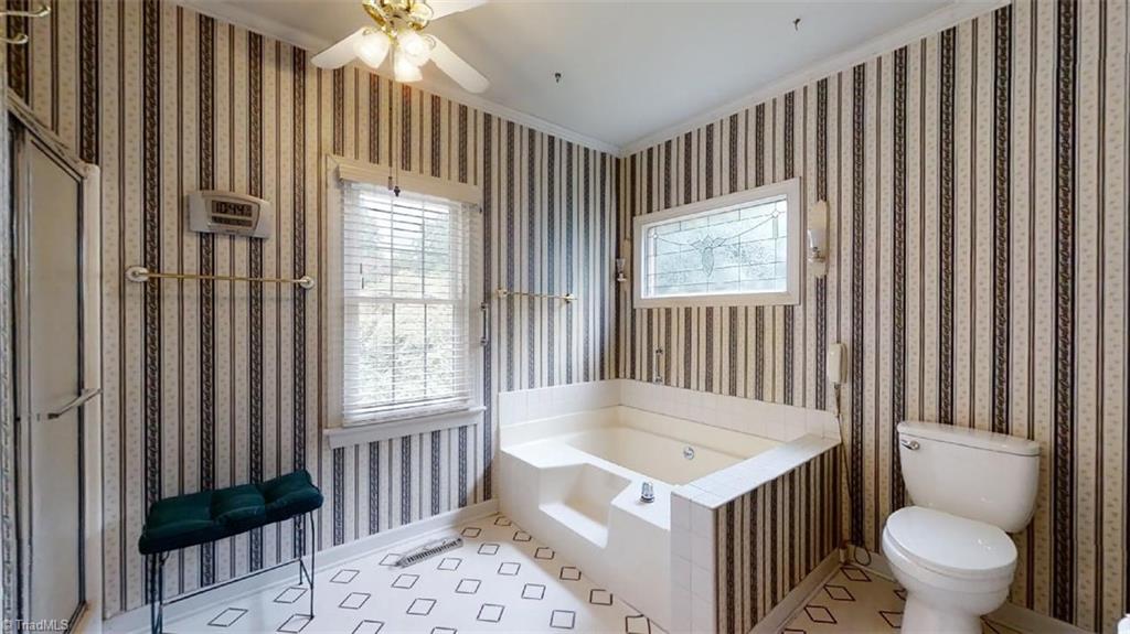 516 Barrett Road Winston-Salem, NC 27104 - Photo 13 of 25 Features a garden tub perfect for relaxing baths and a separate walk in shower.