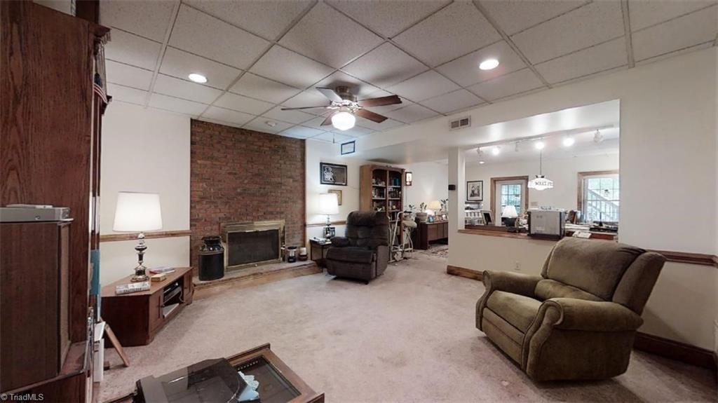 516 Barrett Road Winston-Salem, NC 27104 - Photo 20 of 25 Spacious Den/family room on lower level with fireplace and gas logs.