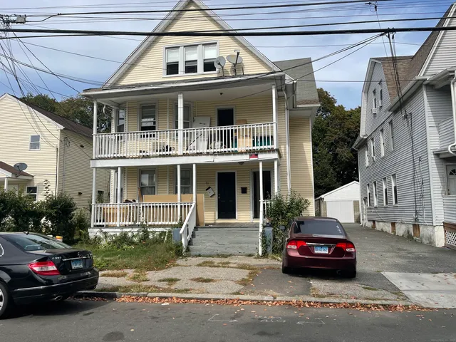 a car parked in front of a house