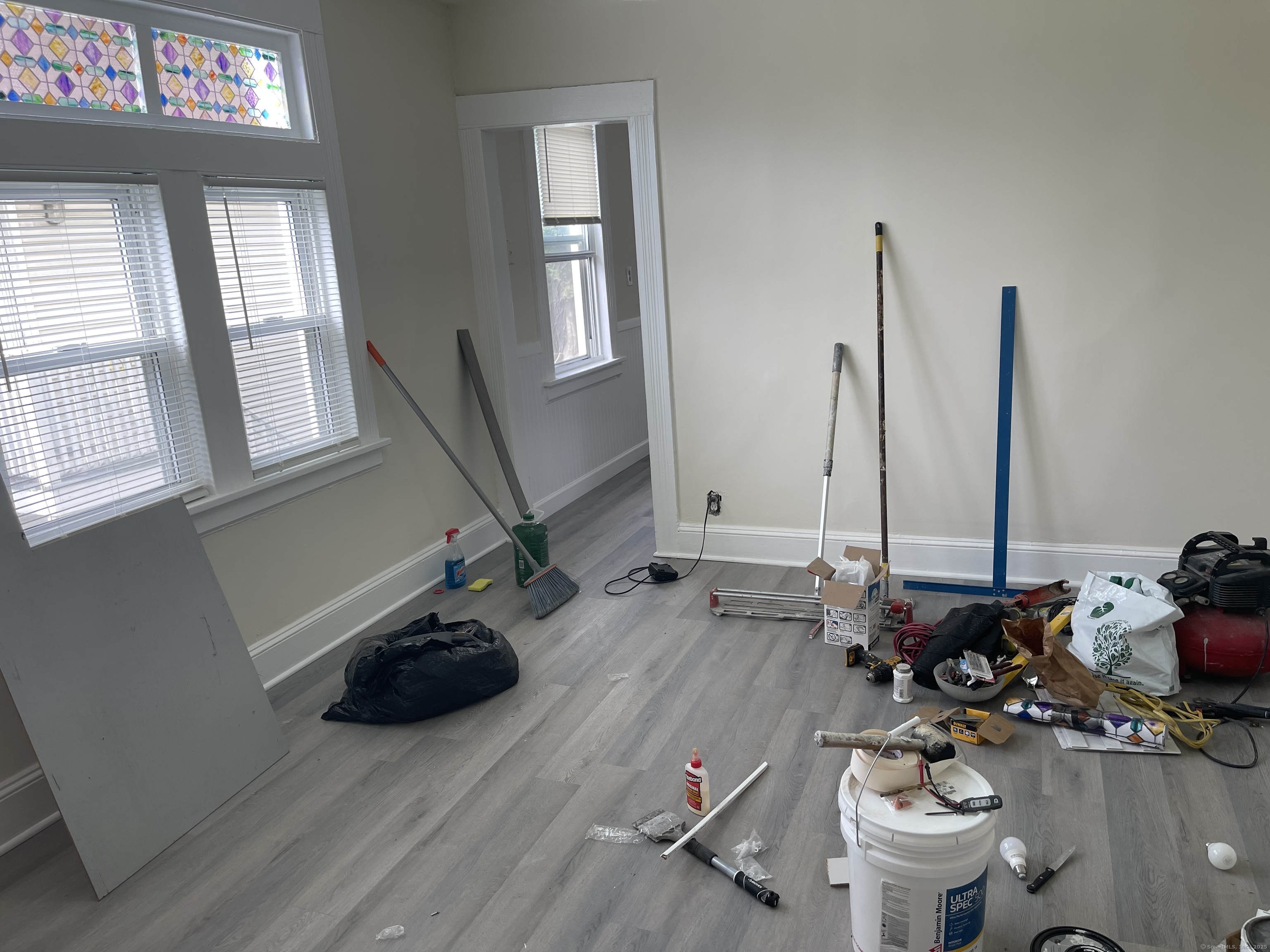 Undisclosed Address Bridgeport, CT 06607 - Photo 11 of 11 a room with furniture and a wooden floor