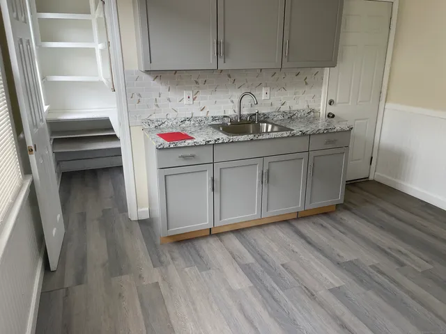 a kitchen with a sink and cabinets