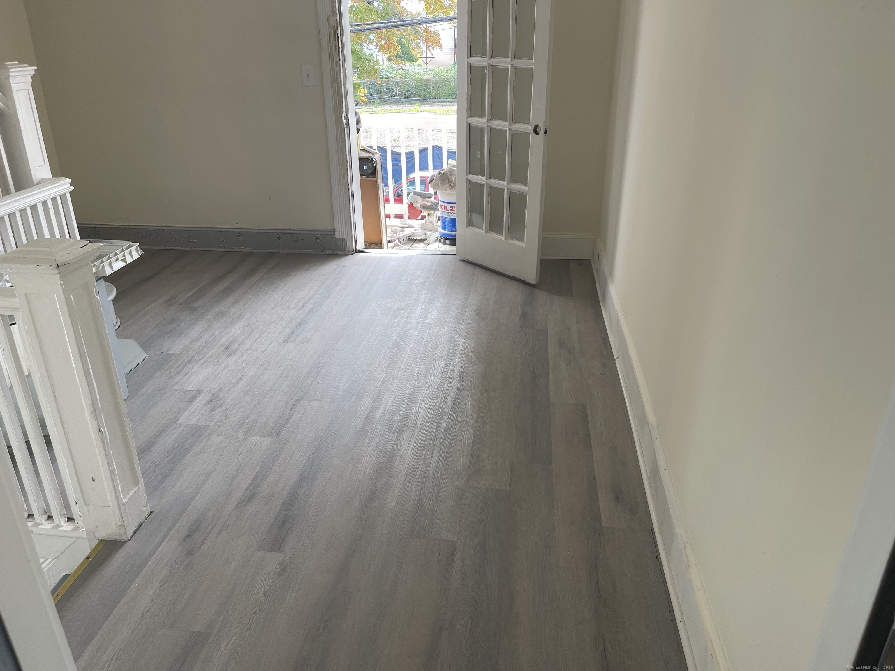 Undisclosed Address Bridgeport, CT 06607 - Photo 10 of 11 an empty room with wooden floor and windows