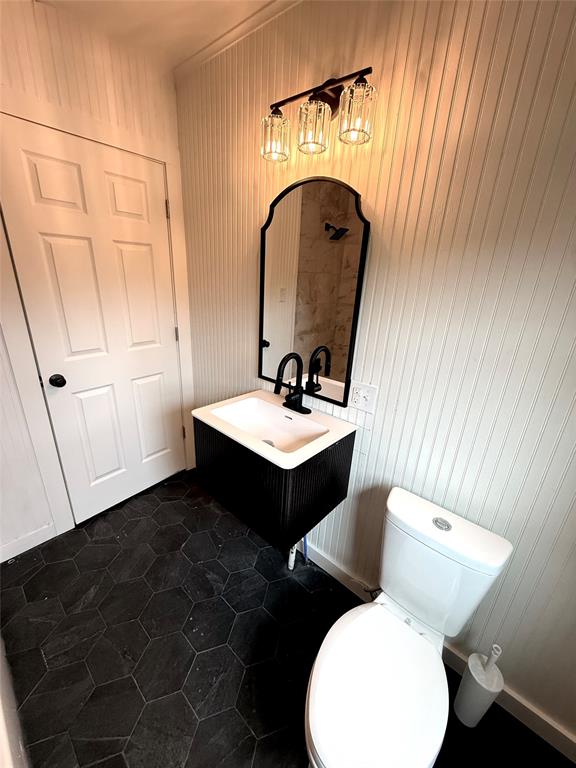 610 5th Street Hawley, TX 79525 - Photo 14 of 19 a bathroom with a sink and a mirror