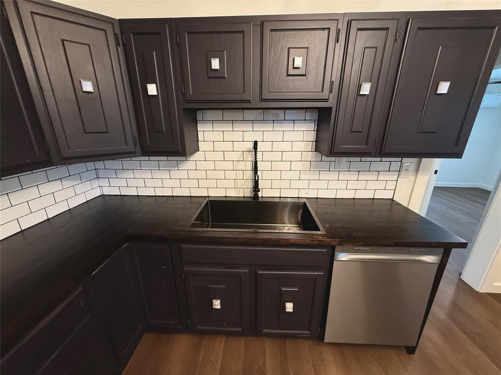 610 5th Street Hawley, TX 79525 - Photo 2 of 19 a kitchen with a sink a stove and cabinets