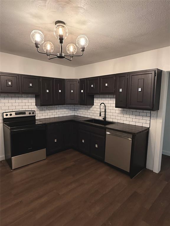 610 5th Street Hawley, TX 79525 - Photo 5 of 19 a kitchen with a sink and cabinets