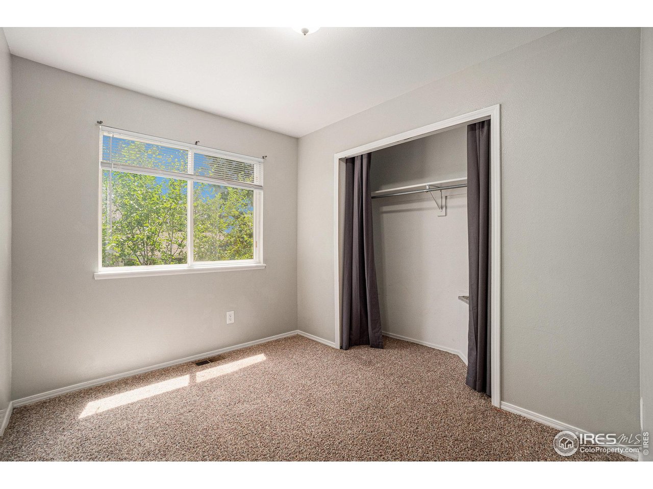 1634 San Juan Circle Evans, CO 80620 - Photo 13 of 20 an empty room with windows and closet