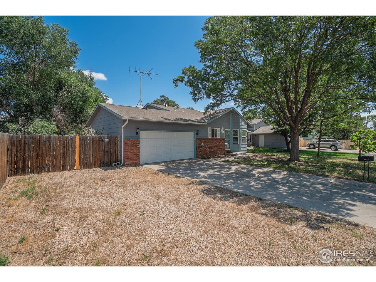 1634 San Juan Circle Evans, CO 80620 - Photo 20 of 20 a front view of a house with a garden