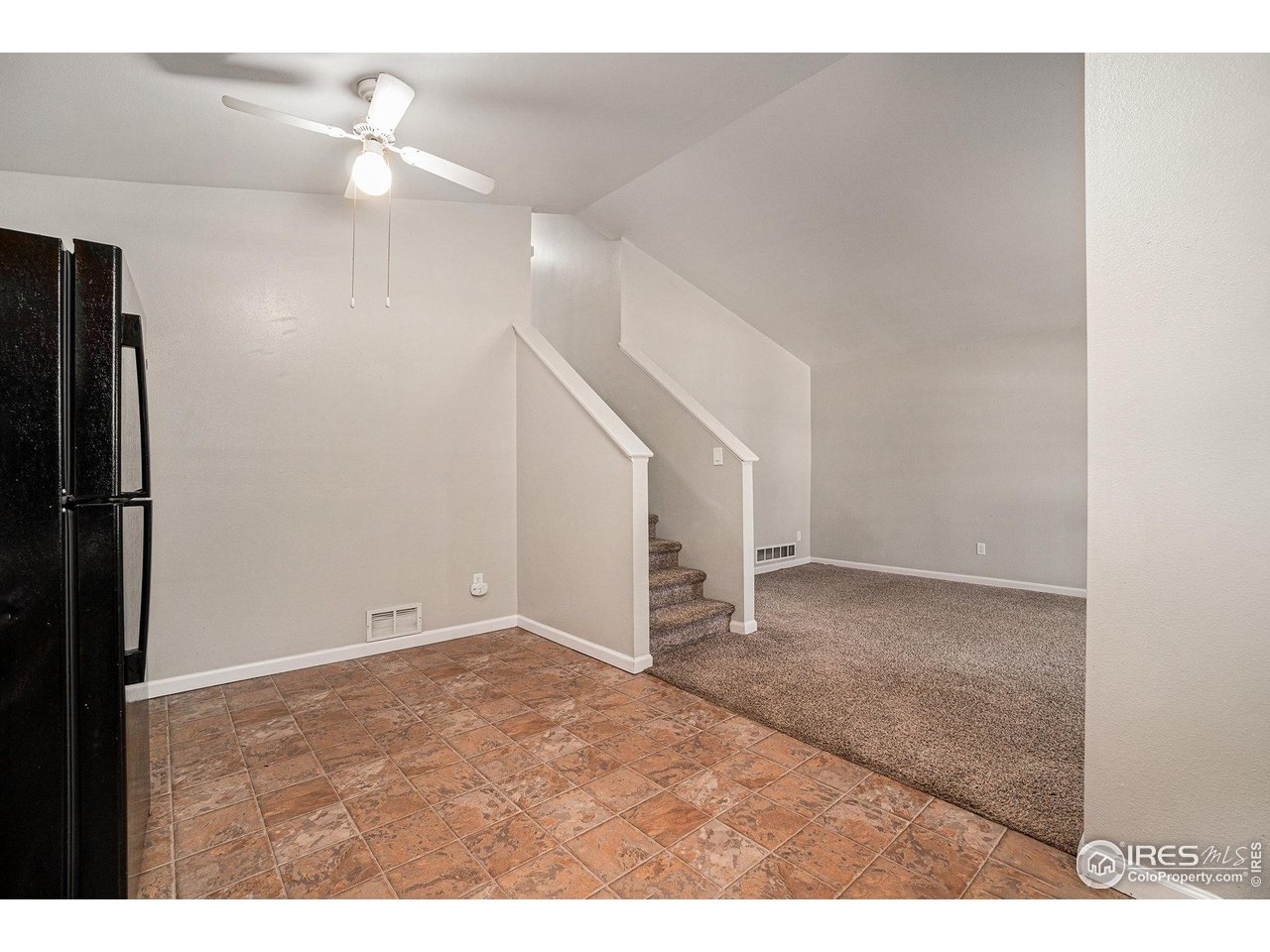 1634 San Juan Circle Evans, CO 80620 - Photo 5 of 20 a view of an empty room with a fan