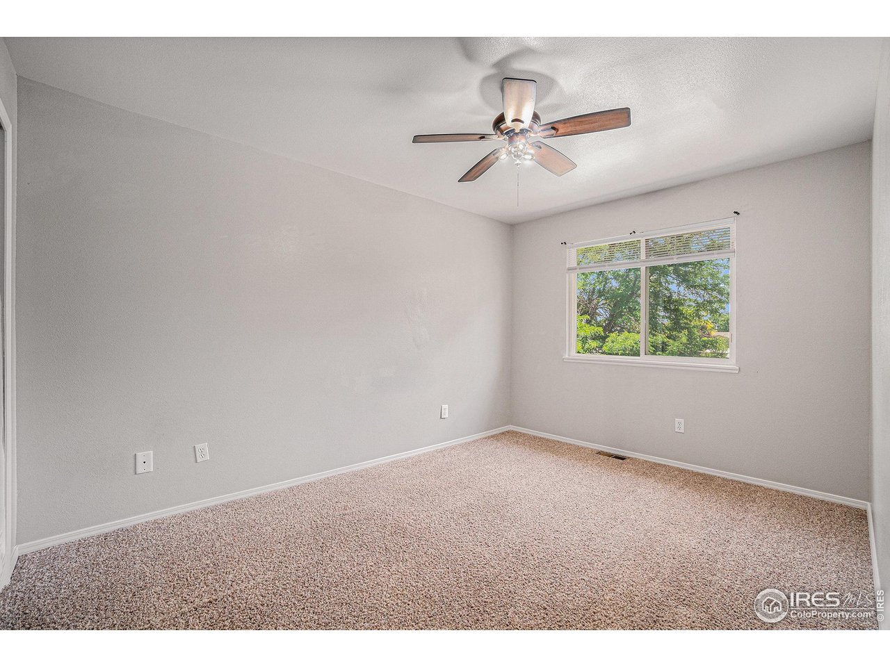 1634 San Juan Circle Evans, CO 80620 - Photo 7 of 20 a view of an empty room with a window