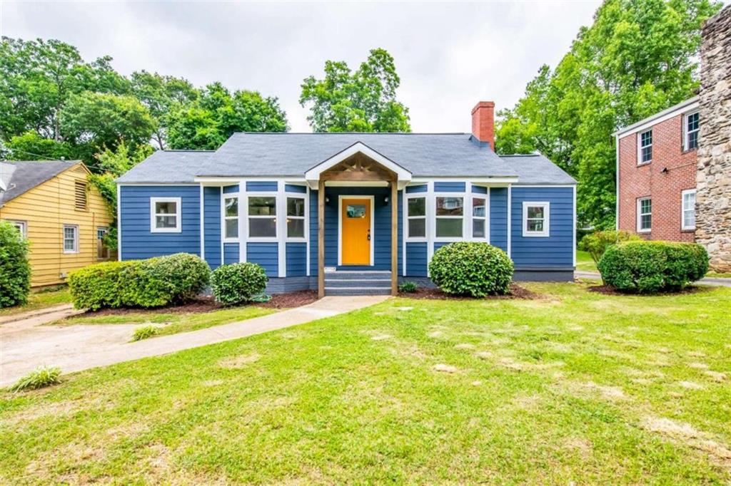 a front view of a house with a yard
