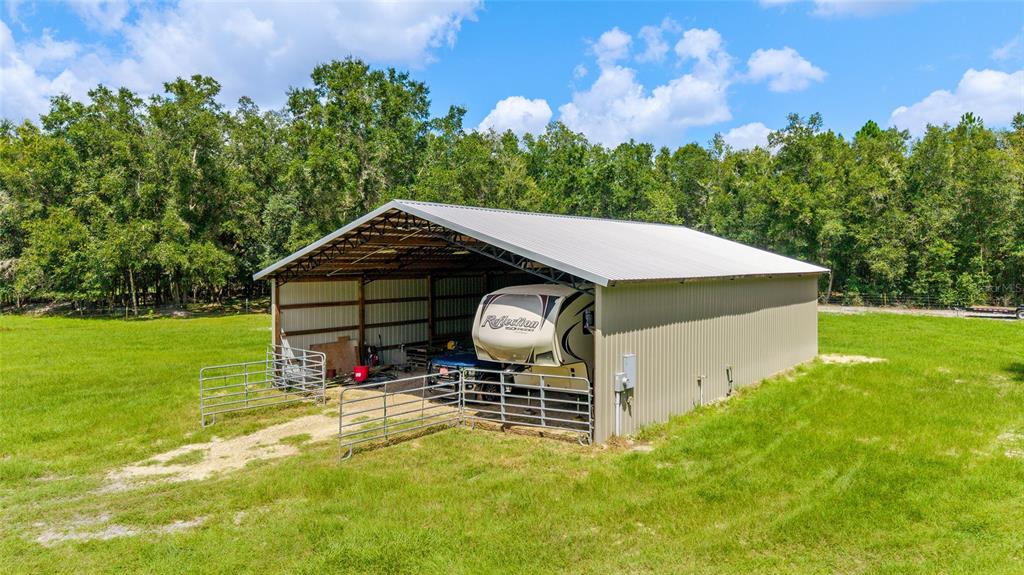 Tbd Southeast 35 Street Morriston, FL 32668 - Photo 14 of 19 a backyard of a house with table and chairs