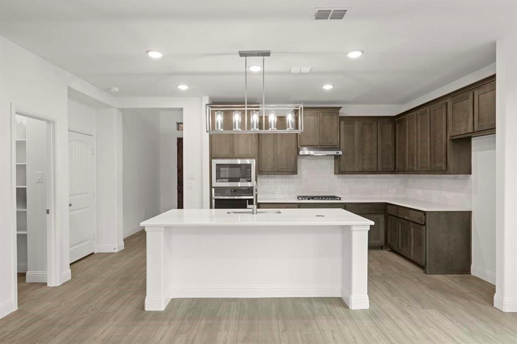 1443 Canadian Lane Van Alstyne, TX 75495 - Photo 5 of 24 05-1443-canadian-ln-van-alstyne-tx-kitchen-front-view