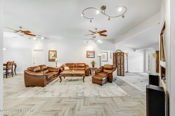 a living room with furniture and flat screen tv