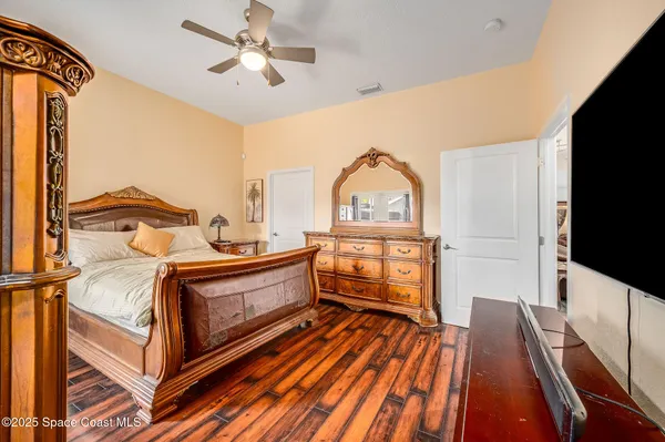 a view of bedroom with a bed and a window