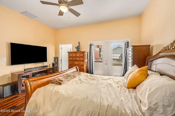 a view of a room with wooden floor and balcony