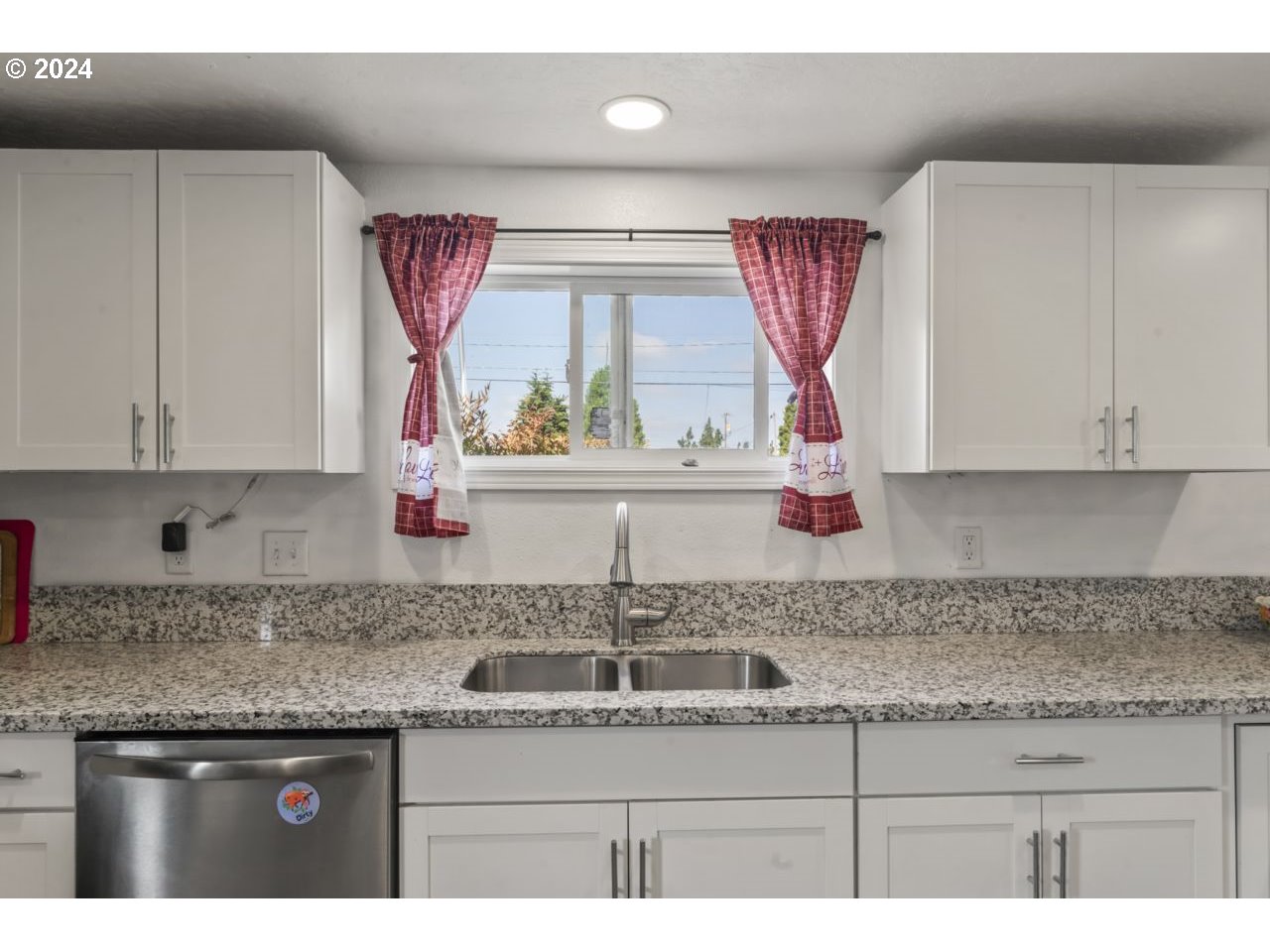1147 33rd Street Springfield, OR 97478 - Photo 12 of 44 a kitchen with stainless steel appliances granite countertop a sink and a white cabinets