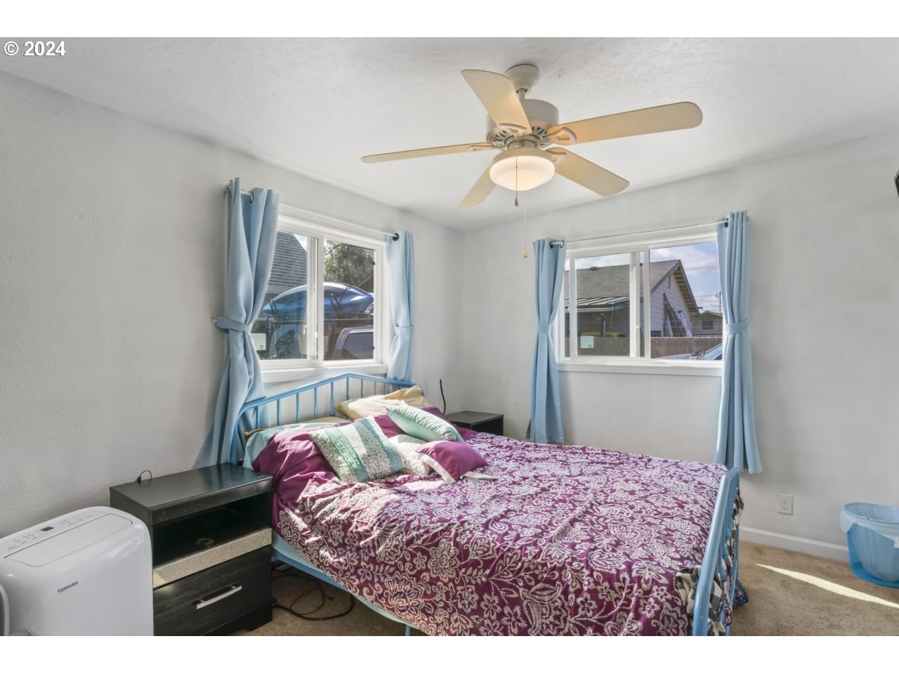 1147 33rd Street Springfield, OR 97478 - Photo 25 of 44 a bedroom with a bed dresser and a window