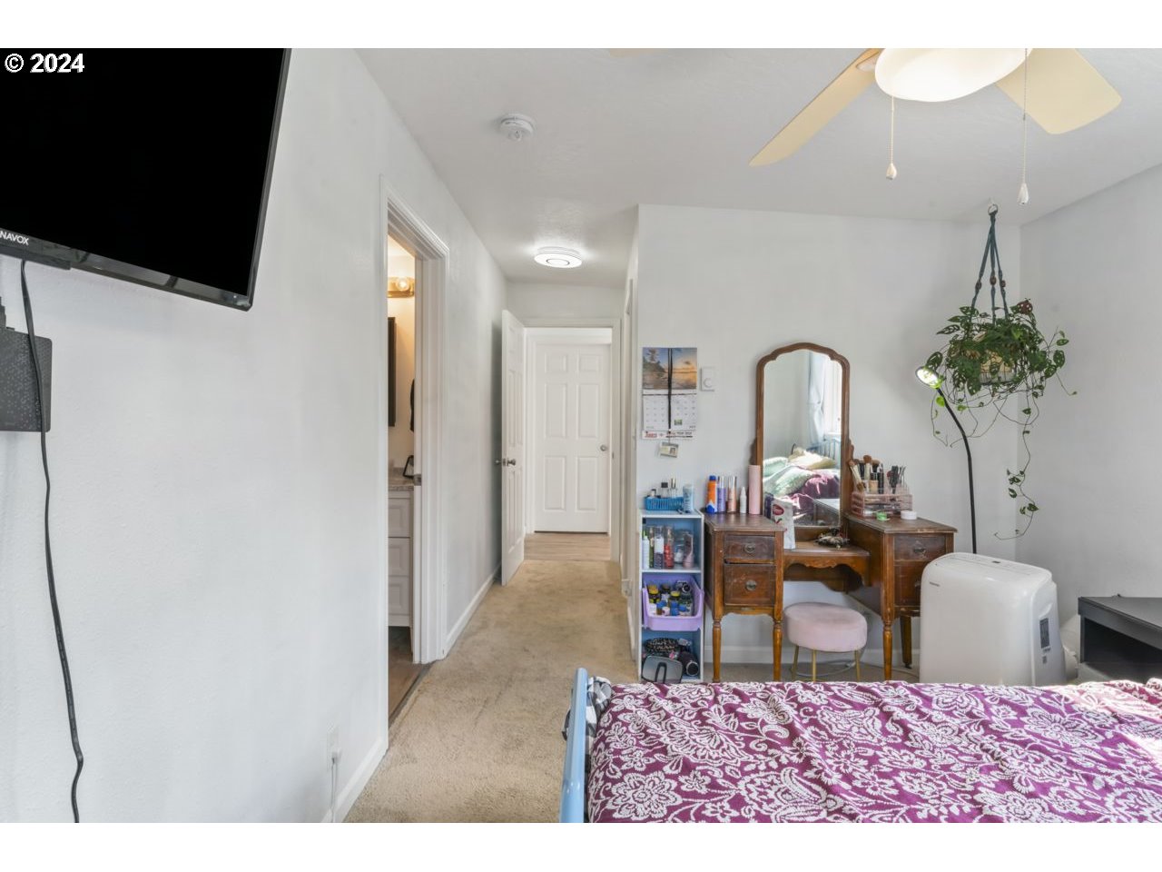 1147 33rd Street Springfield, OR 97478 - Photo 27 of 44 a living room with furniture a flat screen tv and a painting on the wall