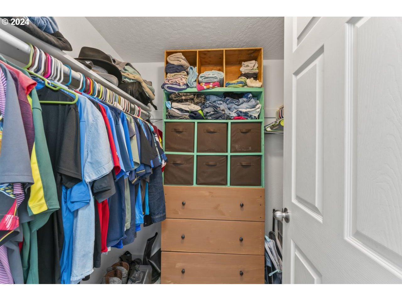1147 33rd Street Springfield, OR 97478 - Photo 28 of 44 a view of walk in closet with clothes and shoes