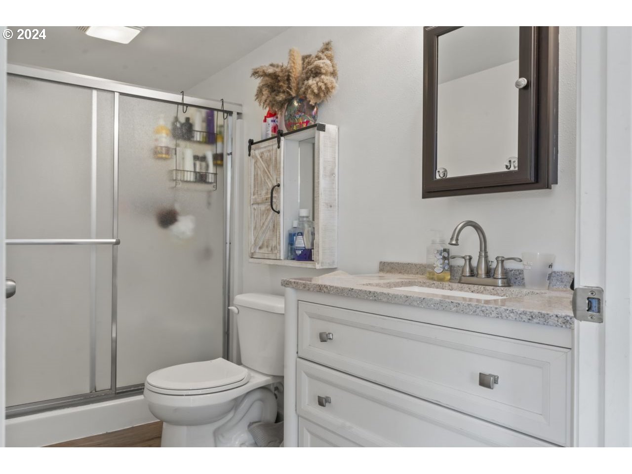 1147 33rd Street Springfield, OR 97478 - Photo 31 of 44 a bathroom with a sink a toilet and shower